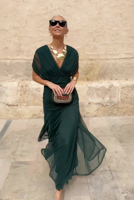 Women’s pleated V-neck maxi dress with flowing skirt and soft gradient tones