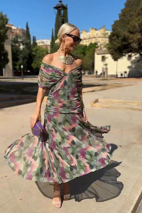 Women’s pleated V-neck maxi dress with flowing skirt and soft gradient tones