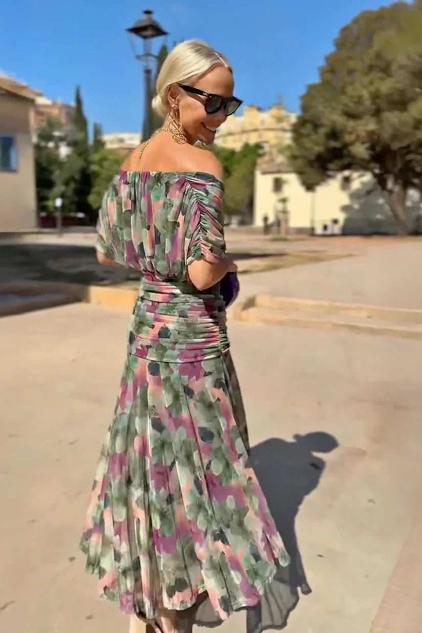 Women’s pleated V-neck maxi dress with flowing skirt and soft gradient tones