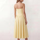Women's sweetheart corset midi dress featuring a structured corset-inspired bodice, adjustable spaghetti straps, a defined waist, and a softly pleated A-line skirt. An elegant midi dress for weddings, cocktail parties, race days, and formal occasions.