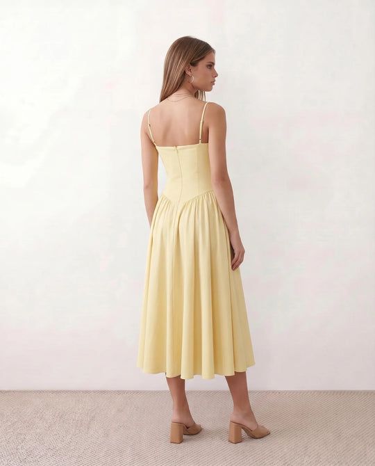 Women's sweetheart corset midi dress featuring a structured corset-inspired bodice, adjustable spaghetti straps, a defined waist, and a softly pleated A-line skirt. An elegant midi dress for weddings, cocktail parties, race days, and formal occasions.