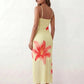 Women's floral slip maxi dress with a square neckline, delicate spaghetti straps, and a body-skimming silhouette featuring an all-over floral print on a sheer mesh overlay, ideal for weddings, summer occasions, and elegant evening wear.