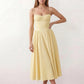 Women's sweetheart corset midi dress featuring a structured corset-inspired bodice, adjustable spaghetti straps, a defined waist, and a softly pleated A-line skirt. An elegant midi dress for weddings, cocktail parties, race days, and formal occasions.