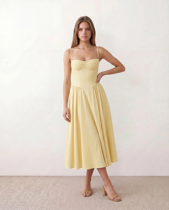 Women's sweetheart corset midi dress featuring a structured corset-inspired bodice, adjustable spaghetti straps, a defined waist, and a softly pleated A-line skirt. An elegant midi dress for weddings, cocktail parties, race days, and formal occasions.