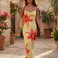 Women's floral slip maxi dress with a square neckline, delicate spaghetti straps, and a body-skimming silhouette featuring an all-over floral print on a sheer mesh overlay, ideal for weddings, summer occasions, and elegant evening wear.