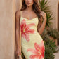 Women's floral slip maxi dress with a square neckline, delicate spaghetti straps, and a body-skimming silhouette featuring an all-over floral print on a sheer mesh overlay, ideal for weddings, summer occasions, and elegant evening wear.