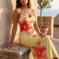 Women's floral slip maxi dress with a square neckline, delicate spaghetti straps, and a body-skimming silhouette featuring an all-over floral print on a sheer mesh overlay, ideal for weddings, summer occasions, and elegant evening wear.