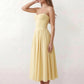 Women's sweetheart corset midi dress featuring a structured corset-inspired bodice, adjustable spaghetti straps, a defined waist, and a softly pleated A-line skirt. An elegant midi dress for weddings, cocktail parties, race days, and formal occasions.