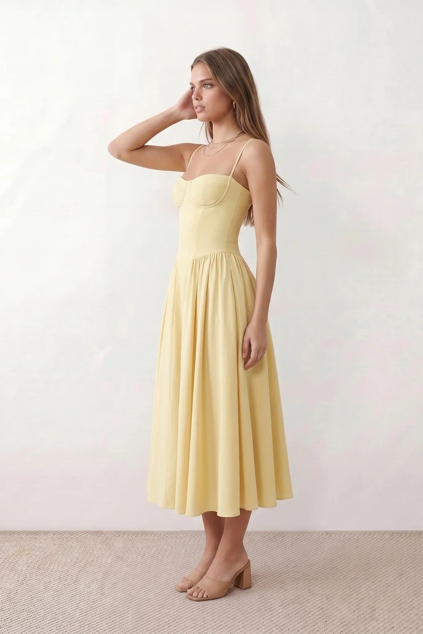 Women's sweetheart corset midi dress featuring a structured corset-inspired bodice, adjustable spaghetti straps, a defined waist, and a softly pleated A-line skirt. An elegant midi dress for weddings, cocktail parties, race days, and formal occasions.