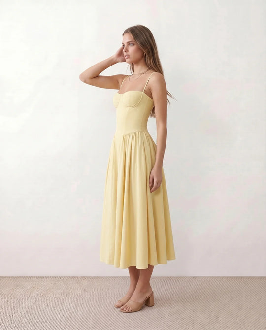 Women's sweetheart corset midi dress featuring a structured corset-inspired bodice, adjustable spaghetti straps, a defined waist, and a softly pleated A-line skirt. An elegant midi dress for weddings, cocktail parties, race days, and formal occasions.